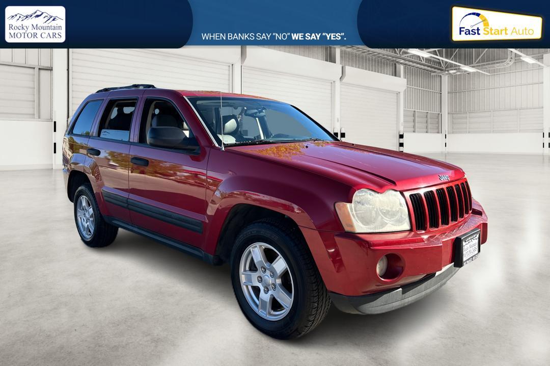 2005 Red Jeep Grand Cherokee Laredo 2WD (1J8HS48N25C) with an 4.7L V8 SOHC 16V engine, 5-Speed Automatic Overdrive transmission, located at 7755 State Street, Midvale, UT, 84047, (801) 753-9063, 40.610329, -111.892159 - Photo #0