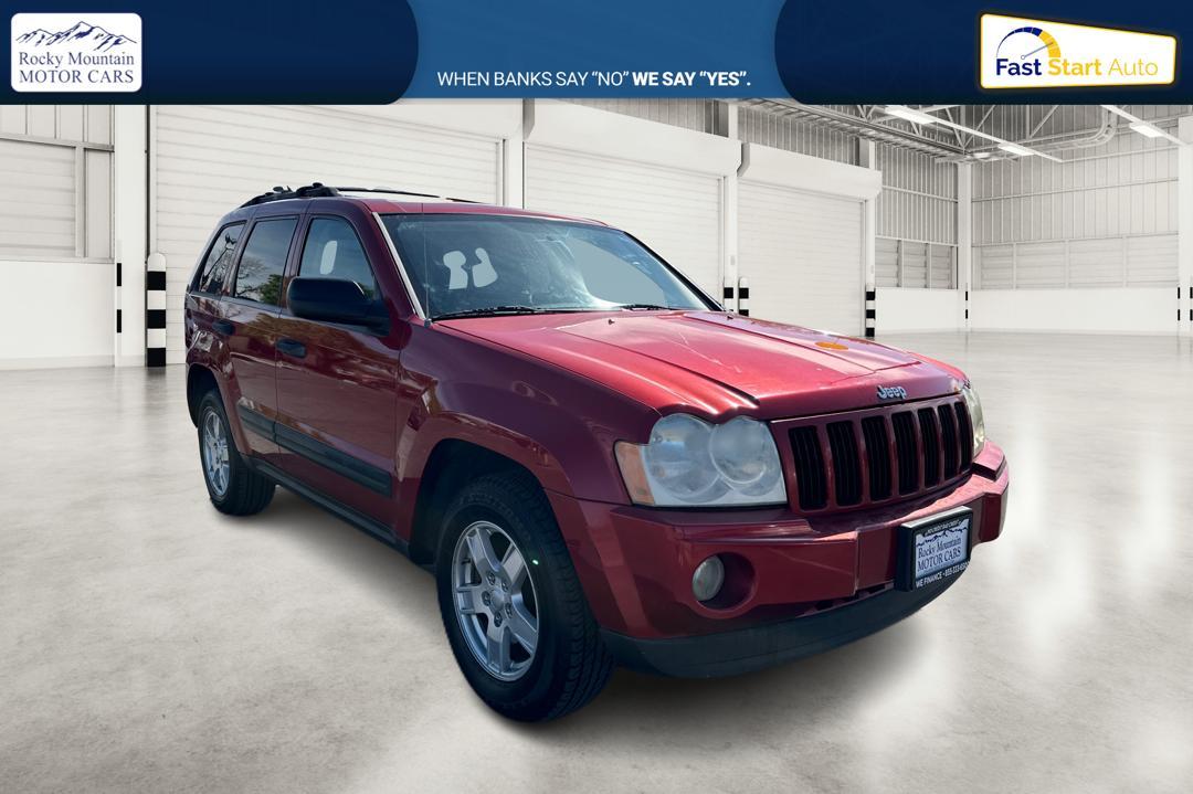 2005 Red Jeep Grand Cherokee Laredo 2WD (1J8HS48N25C) with an 4.7L V8 SOHC 16V engine, 5-Speed Automatic Overdrive transmission, located at 7755 State Street, Midvale, UT, 84047, (801) 753-9063, 40.610329, -111.890656 - Photo #0