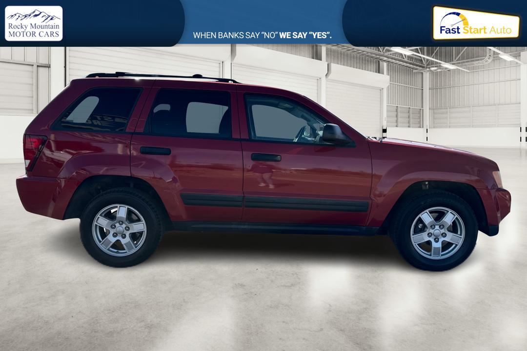 2005 Red Jeep Grand Cherokee Laredo 2WD (1J8HS48N25C) with an 4.7L V8 SOHC 16V engine, 5-Speed Automatic Overdrive transmission, located at 7755 State Street, Midvale, UT, 84047, (801) 753-9063, 40.610329, -111.890656 - Photo #1