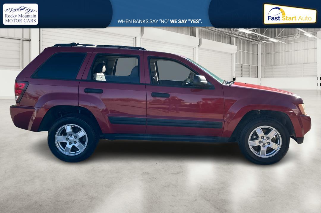 2005 Red Jeep Grand Cherokee Laredo 2WD (1J8HS48N25C) with an 4.7L V8 SOHC 16V engine, 5-Speed Automatic Overdrive transmission, located at 767 S State Road, Pleasant Grove, UT, 84062, (801) 785-1058, 40.354839, -111.736687 - Photo #1