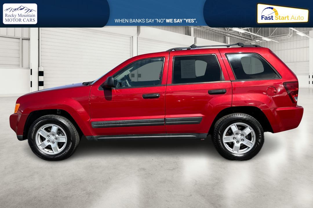2005 Red Jeep Grand Cherokee Laredo 2WD (1J8HS48N25C) with an 4.7L V8 SOHC 16V engine, 5-Speed Automatic Overdrive transmission, located at 7755 State Street, Midvale, UT, 84047, (801) 753-9063, 40.610329, -111.890656 - Photo #5