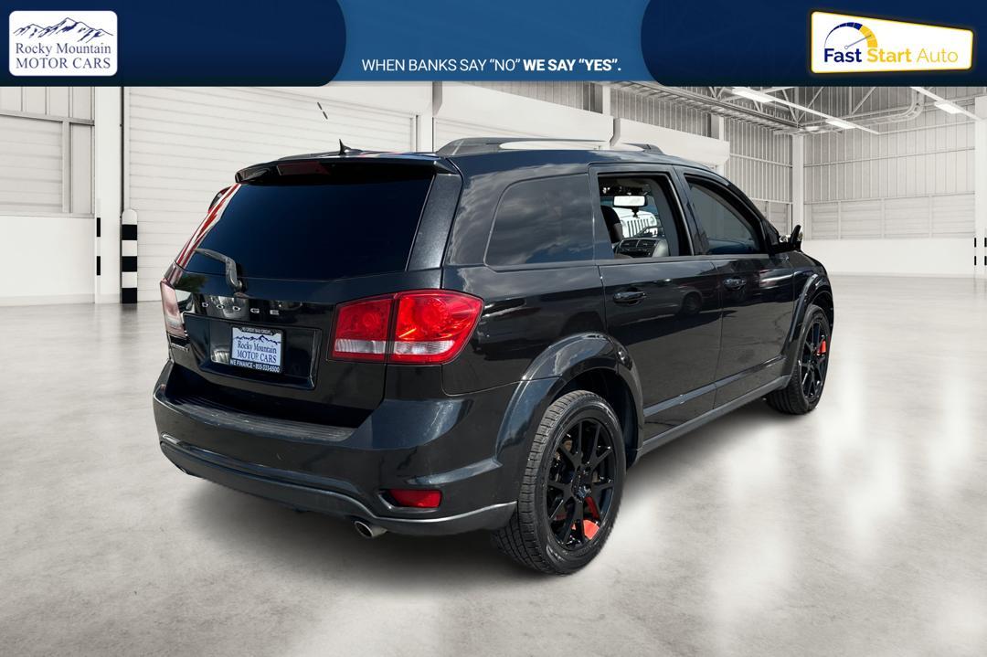 2013 Black Dodge Journey SXT (3C4PDCBGXDT) with an 3.6L V6 DOHC 24V engine, 6-Speed Automatic transmission, located at 7755 State Street, Midvale, UT, 84047, (801) 753-9063, 40.610329, -111.890656 - Photo #2