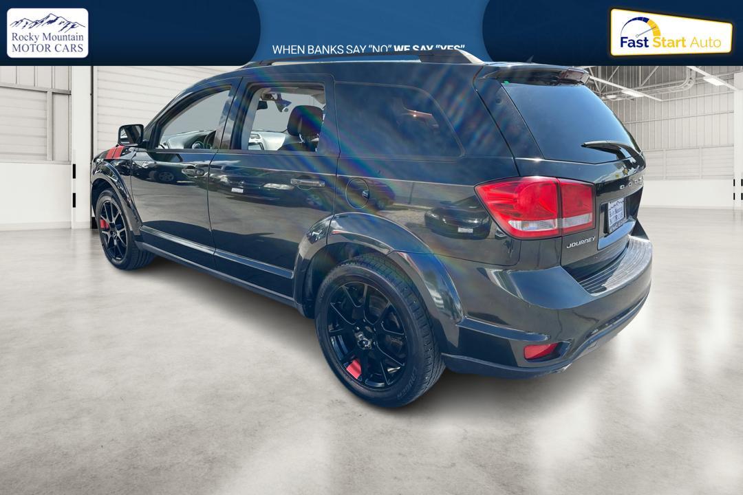 2013 Black Dodge Journey SXT (3C4PDCBGXDT) with an 3.6L V6 DOHC 24V engine, 6-Speed Automatic transmission, located at 7755 State Street, Midvale, UT, 84047, (801) 753-9063, 40.610329, -111.890656 - Photo #4