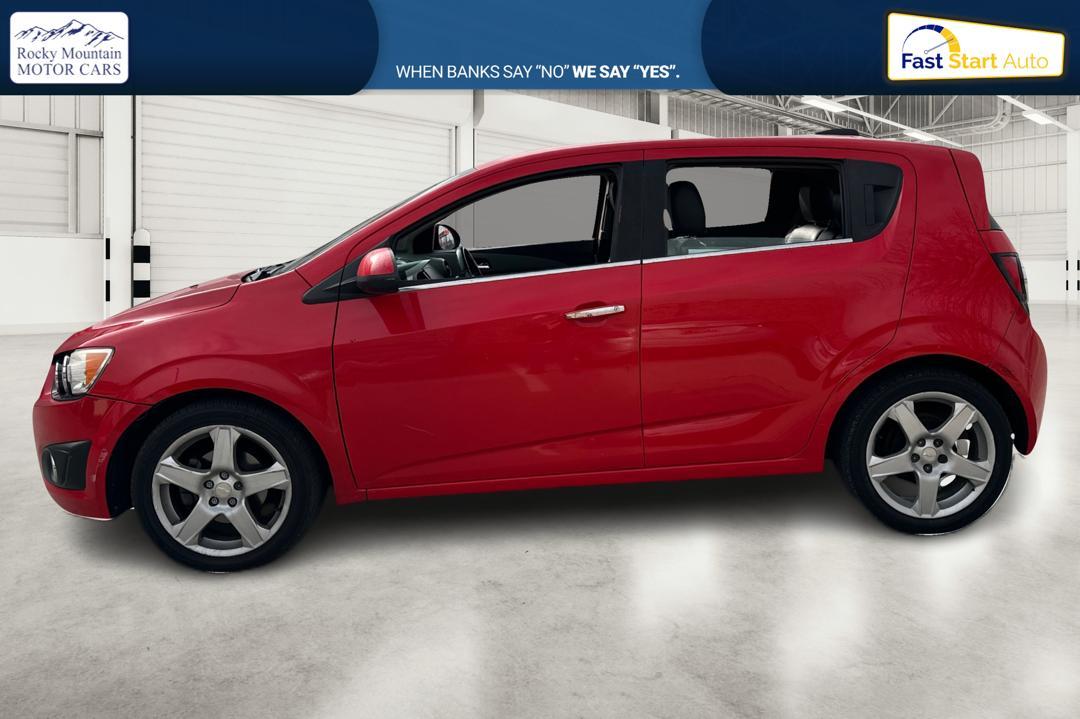 2015 Red Chevrolet Sonic LTZ Auto 5-Door (1G1JE6SB1F4) with an 1.4L L4 DOHC 24V TURBO engine, 6-Speed Automatic transmission, located at 767 S State Road, Pleasant Grove, UT, 84062, (801) 785-1058, 40.354839, -111.736687 - Photo#6