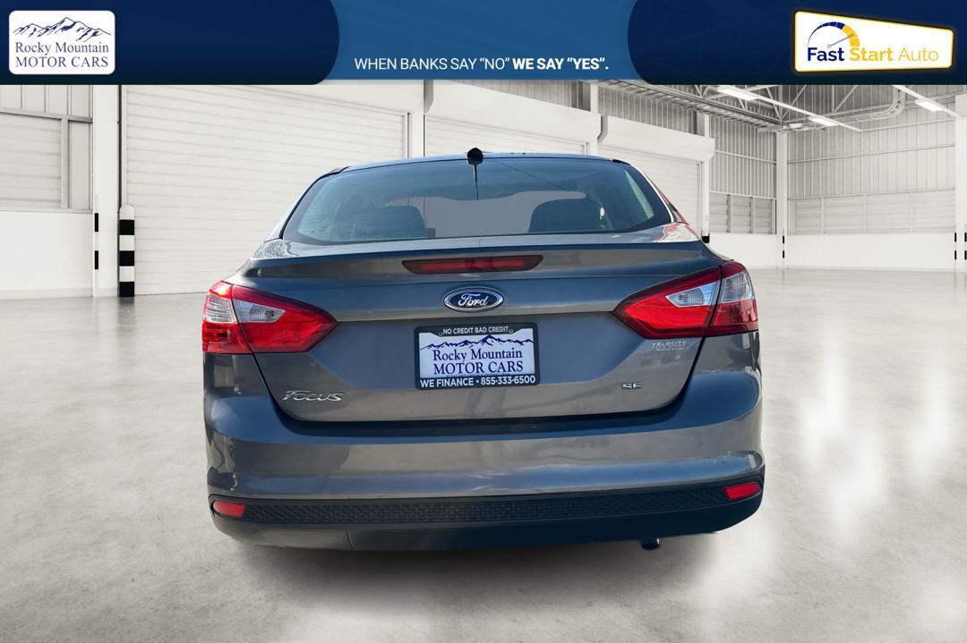 2013 Gray Ford Focus SE Sedan (1FADP3F26DL) with an 2.0L L4 DOHC 16V engine, Auto 6Spd PwrShft SelShft transmission, located at 7755 State Street, Midvale, UT, 84047, (801) 753-9063, 40.610329, -111.890656 - Photo #3