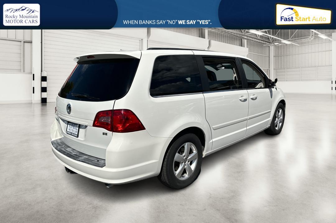 2011 White Volkswagen Routan SE (2V4RW3DG8BR) with an 3.6L V6 DOHC 24V engine, 6-Speed Automatic transmission, located at 767 S State Road, Pleasant Grove, UT, 84062, (801) 785-1058, 40.352489, -111.732628 - Photo #2