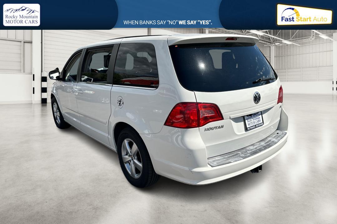 2011 White Volkswagen Routan SE (2V4RW3DG8BR) with an 3.6L V6 DOHC 24V engine, 6-Speed Automatic transmission, located at 767 S State Road, Pleasant Grove, UT, 84062, (801) 785-1058, 40.352489, -111.732628 - Photo #4