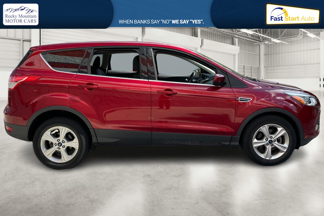 2016 Red Ford Escape SE FWD (1FMCU0G79GU) with an 2.5L L4 DOHC 16V engine, 6-Speed Automatic transmission, located at 767 S State Road, Pleasant Grove, UT, 84062, (801) 785-1058, 40.354839, -111.736687 - Photo#1