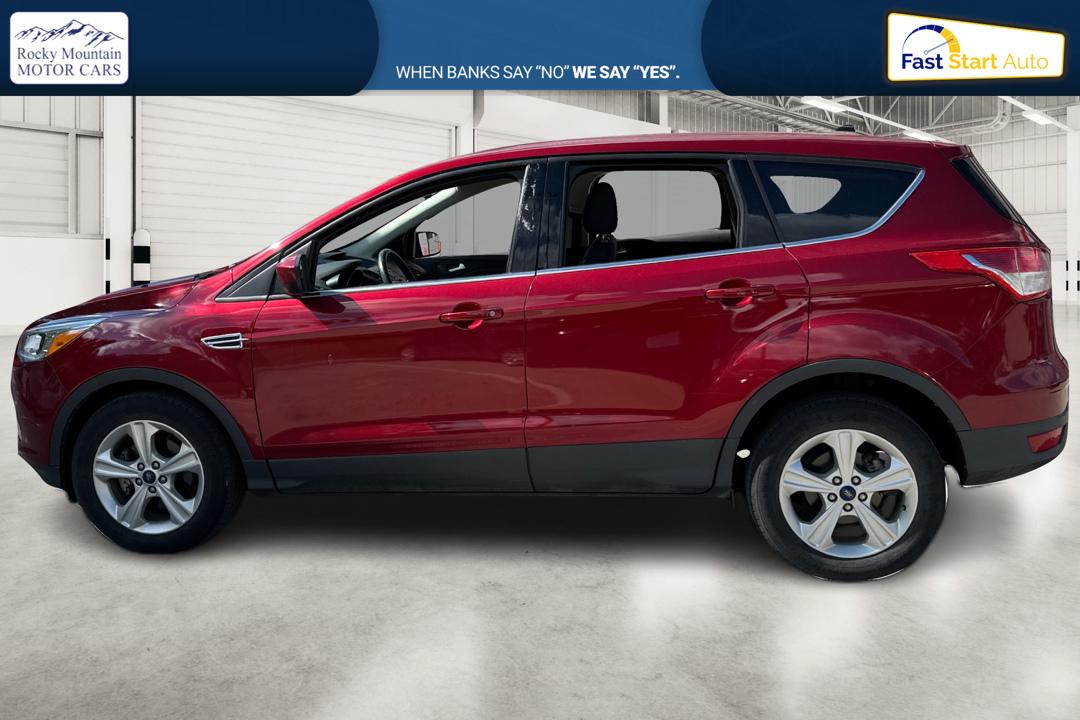 2016 Red Ford Escape SE FWD (1FMCU0G79GU) with an 2.5L L4 DOHC 16V engine, 6-Speed Automatic transmission, located at 767 S State Road, Pleasant Grove, UT, 84062, (801) 785-1058, 40.354839, -111.736687 - Photo#6