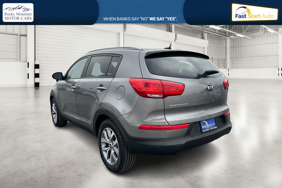2015 Silver Kia Sportage LX FWD (KNDPB3AC7F7) with an 2.4L V6 DOHC 24V engine, 6-Speed Automatic transmission, located at 344 S Washington Blvd, Ogden, UT, 84404, (801) 399-1799, 41.255482, -111.970848 - Photo#5