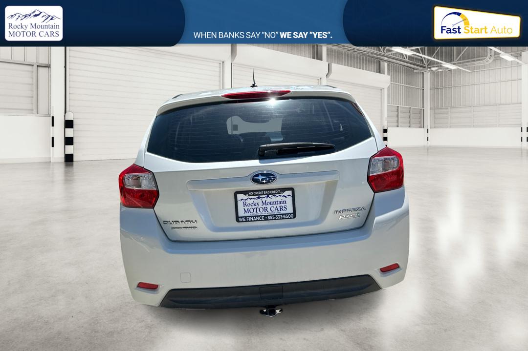 2014 White Subaru Impreza 2.0i Premium 5-Door w/All Weather Package (JF1GPAC66EH) with an 2.0L H4 DOHC 16V engine, Continuously Variable Transmission transmission, located at 767 S State Road, Pleasant Grove, UT, 84062, (801) 785-1058, 40.354839, -111.736687 - Photo#4