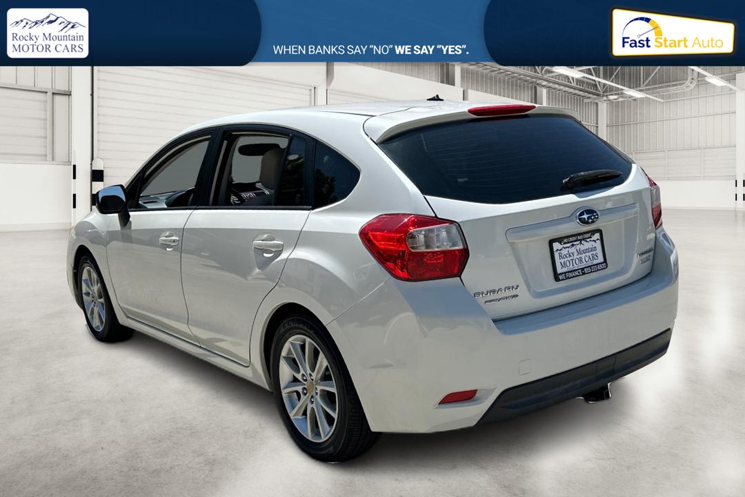 2014 White Subaru Impreza 2.0i Premium 5-Door w/All Weather Package (JF1GPAC66EH) with an 2.0L H4 DOHC 16V engine, Continuously Variable Transmission transmission, located at 767 S State Road, Pleasant Grove, UT, 84062, (801) 785-1058, 40.354839, -111.736687 - Photo#5