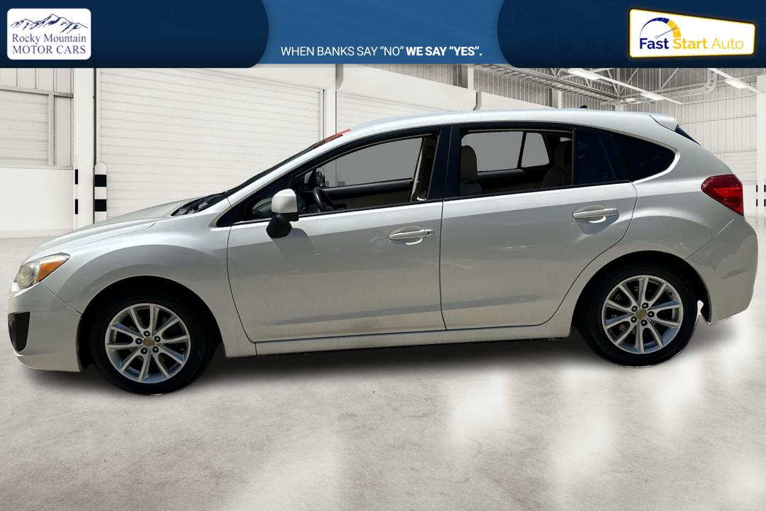 2014 White Subaru Impreza 2.0i Premium 5-Door w/All Weather Package (JF1GPAC66EH) with an 2.0L H4 DOHC 16V engine, Continuously Variable Transmission transmission, located at 767 S State Road, Pleasant Grove, UT, 84062, (801) 785-1058, 40.354839, -111.736687 - Photo#6