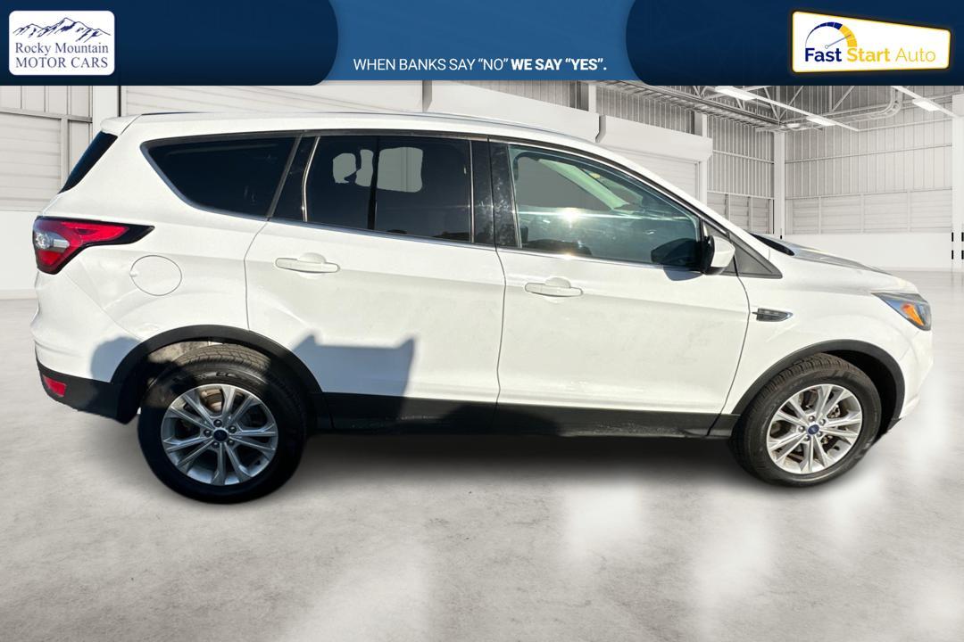 2017 White Ford Escape SE 4WD (1FMCU9GD3HU) with an 1.5L L4 DOHC 16V engine, 6A transmission, located at 7755 State Street, Midvale, UT, 84047, (801) 753-9063, 40.610329, -111.890656 - Photo #1