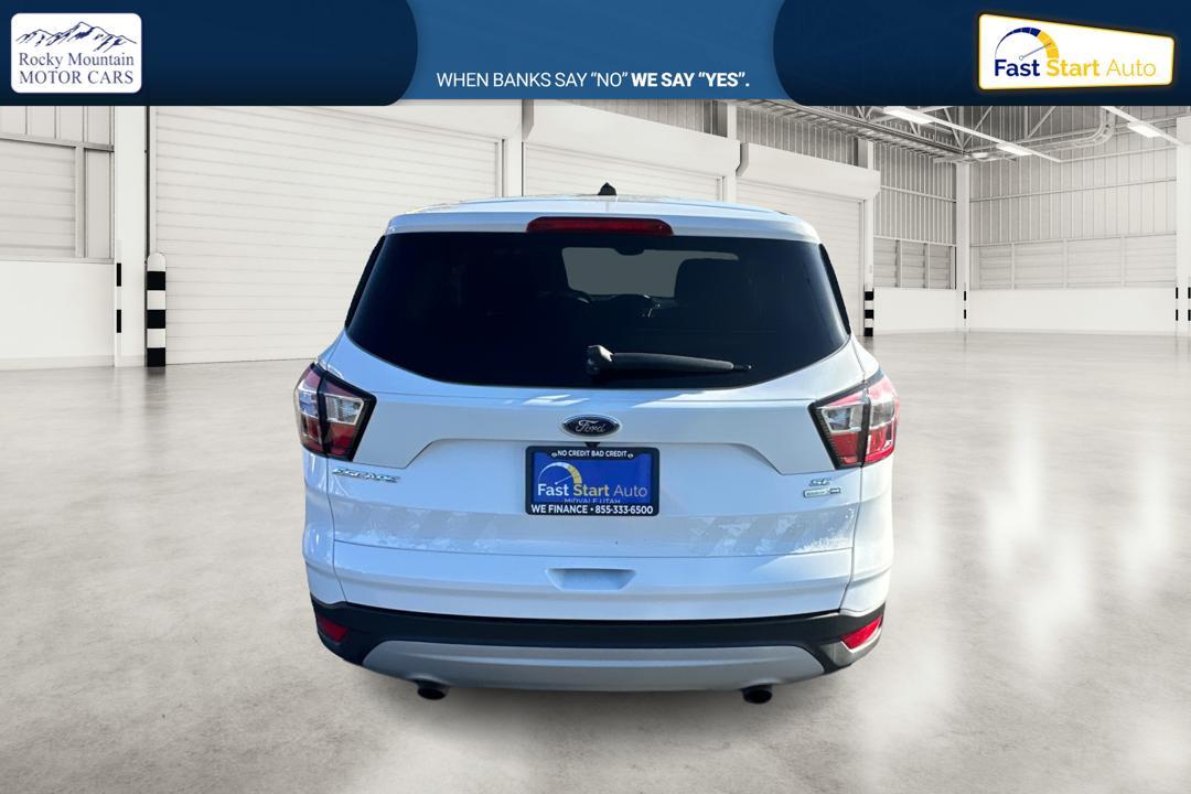 2017 White Ford Escape SE 4WD (1FMCU9GD3HU) with an 1.5L L4 DOHC 16V engine, 6A transmission, located at 7755 State Street, Midvale, UT, 84047, (801) 753-9063, 40.610329, -111.890656 - Photo #3