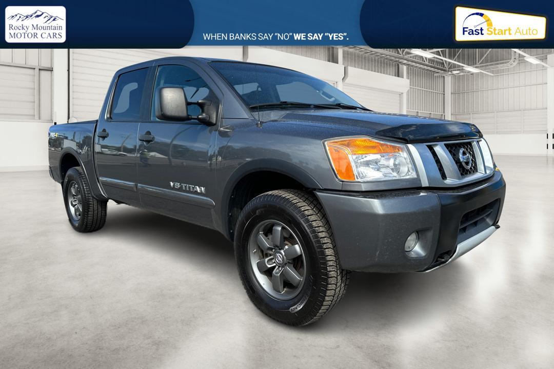 2015 Gray Nissan Titan PRO-4X Crew Cab 4WD SWB (1N6AA0ECXFN) with an 5.6L V8 DOHC 32V engine, 5-Speed Automatic transmission, located at 767 S State Road, Pleasant Grove, UT, 84062, (801) 785-1058, 40.354839, -111.736687 - Photo #0
