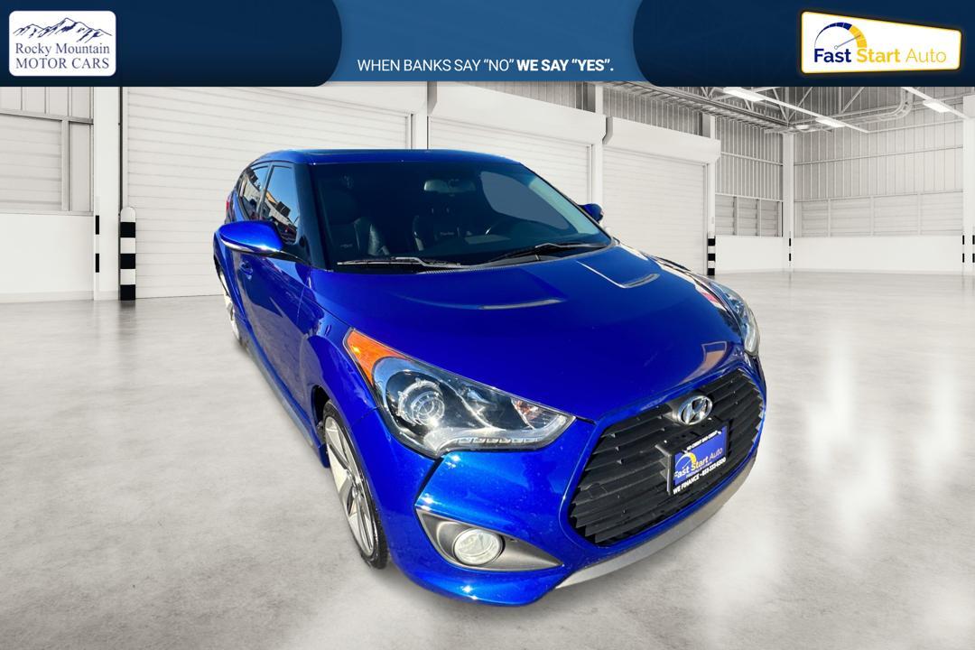 2015 Blue Hyundai Veloster Turbo 6AT (KMHTC6AE6FU) with an 1.6L L4 DOHC 16V TURBO engine, 6-Speed Automatic transmission, located at 767 S State Road, Pleasant Grove, UT, 84062, (801) 785-1058, 40.354839, -111.736687 - Photo #0