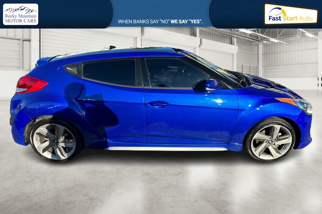 2015 Blue Hyundai Veloster Turbo 6AT (KMHTC6AE6FU) with an 1.6L L4 DOHC 16V TURBO engine, 6-Speed Automatic transmission, located at 767 S State Road, Pleasant Grove, UT, 84062, (801) 785-1058, 40.354839, -111.736687 - Photo #1
