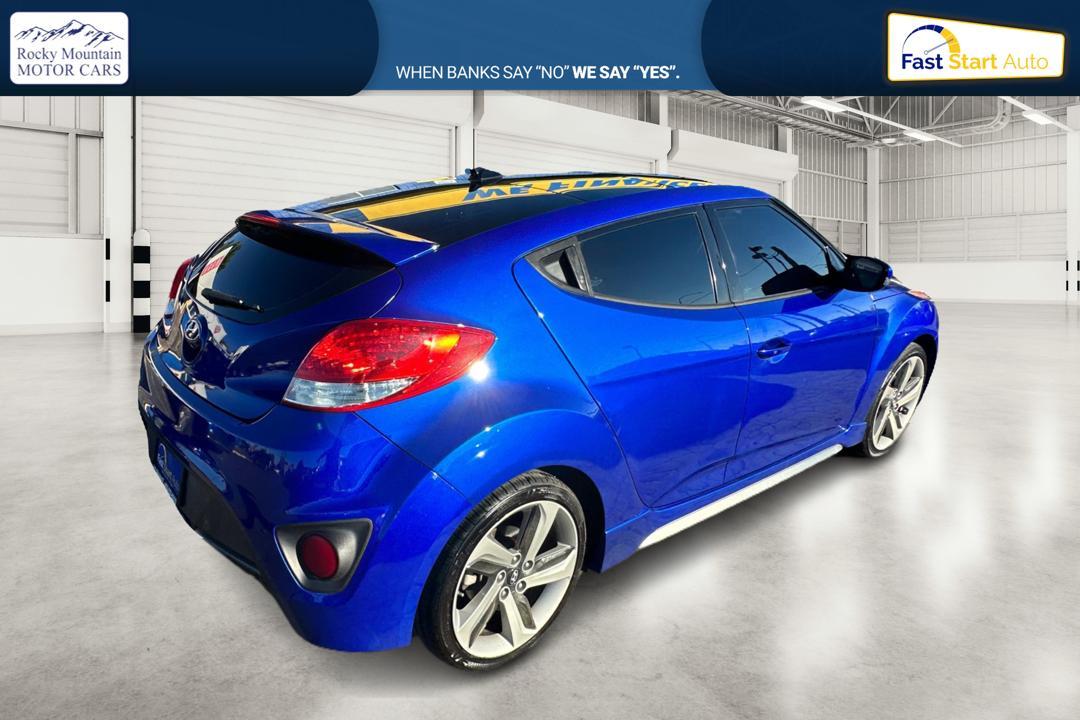 2015 Blue Hyundai Veloster Turbo 6AT (KMHTC6AE6FU) with an 1.6L L4 DOHC 16V TURBO engine, 6-Speed Automatic transmission, located at 767 S State Road, Pleasant Grove, UT, 84062, (801) 785-1058, 40.354839, -111.736687 - Photo #2