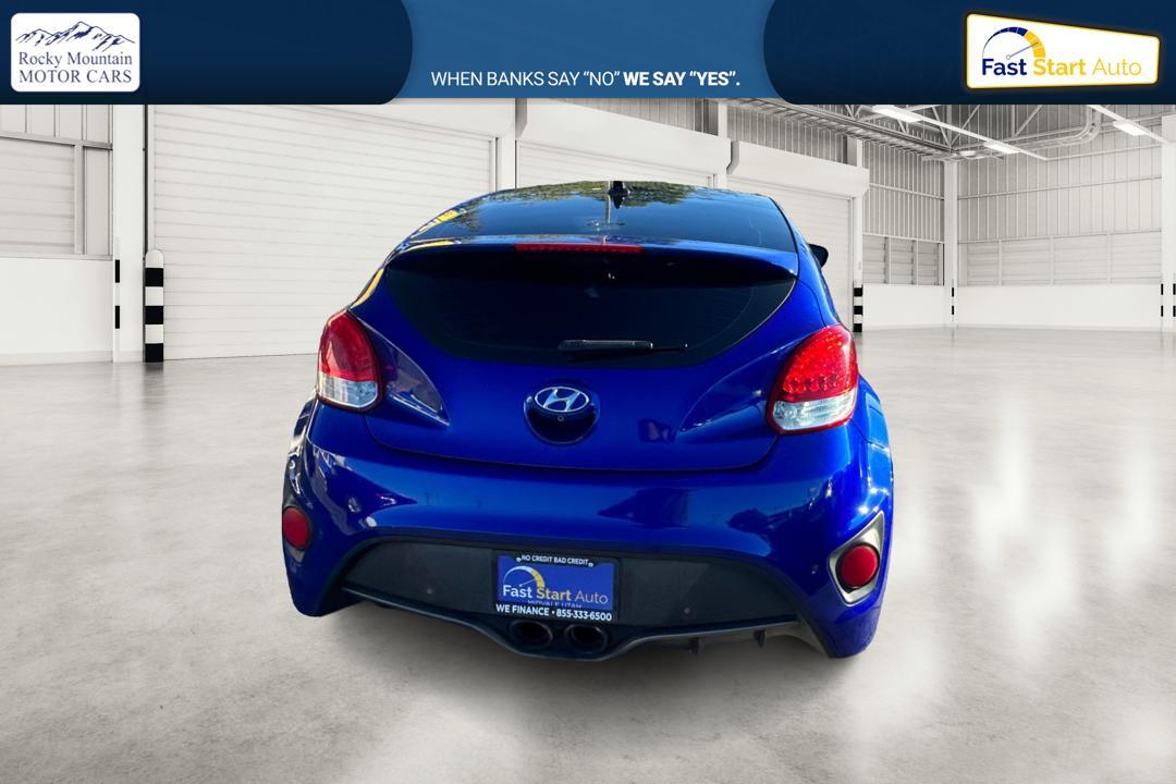 2015 Blue Hyundai Veloster Turbo 6AT (KMHTC6AE6FU) with an 1.6L L4 DOHC 16V TURBO engine, 6-Speed Automatic transmission, located at 767 S State Road, Pleasant Grove, UT, 84062, (801) 785-1058, 40.354839, -111.736687 - Photo #3