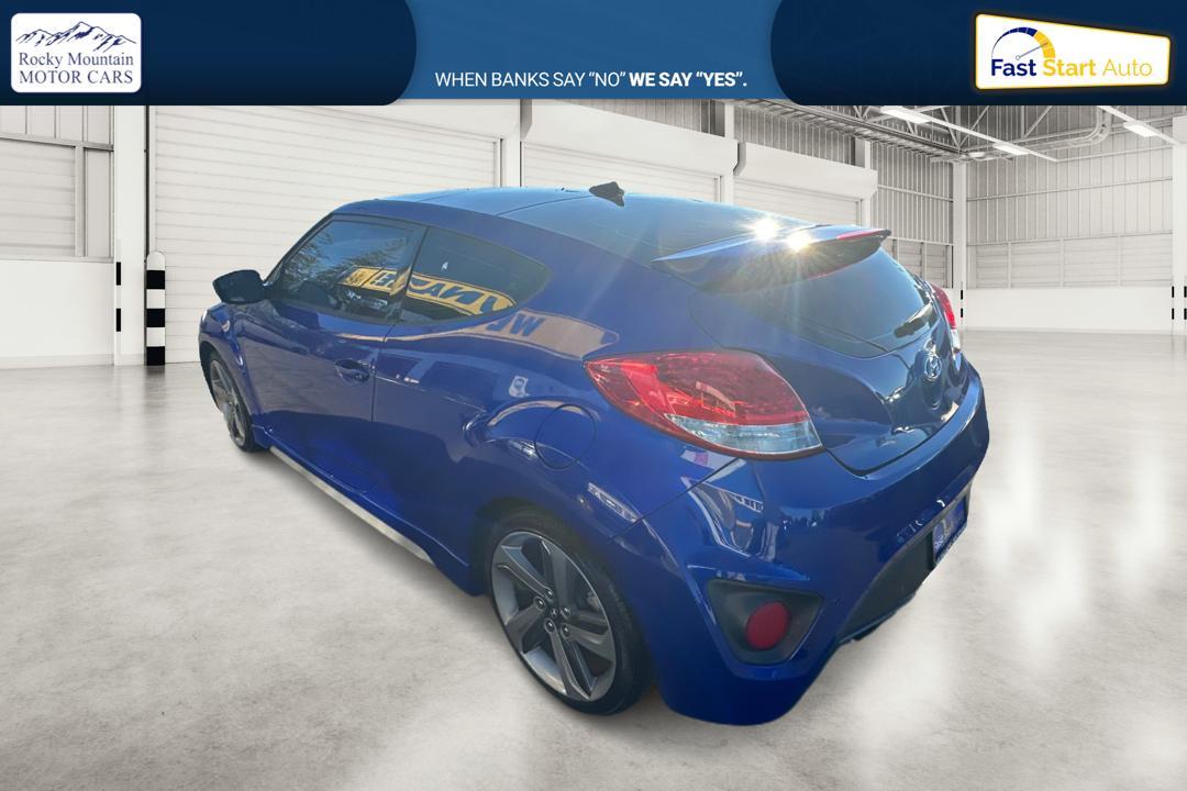 2015 Blue Hyundai Veloster Turbo 6AT (KMHTC6AE6FU) with an 1.6L L4 DOHC 16V TURBO engine, 6-Speed Automatic transmission, located at 767 S State Road, Pleasant Grove, UT, 84062, (801) 785-1058, 40.354839, -111.736687 - Photo #4