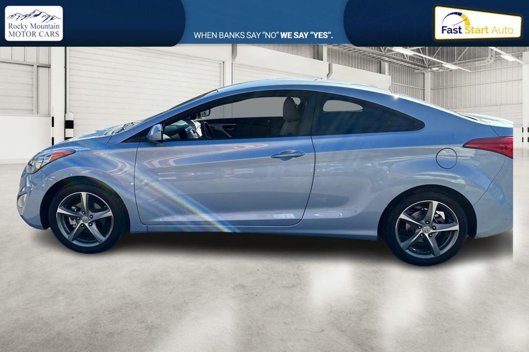 2013 Blue Hyundai Elantra GS Coupe A/T (KMHDH6AE5DU) with an 1.8L L4 DOHC 16V engine, 6-Speed Automatic transmission, located at 7755 State Street, Midvale, UT, 84047, (801) 753-9063, 40.610329, -111.892159 - Photo #5