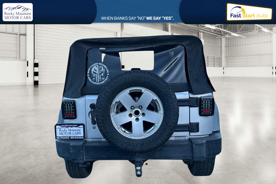 2011 Silver Jeep Wrangler Sport 4WD (1J4AA2D16BL) with an 3.8L V6 OHV 12V engine, Automatic, 4-Spd w/Overdrive transmission, located at 767 S State Road, Pleasant Grove, UT, 84062, (801) 785-1058, 40.354839, -111.736687 - Photo#4