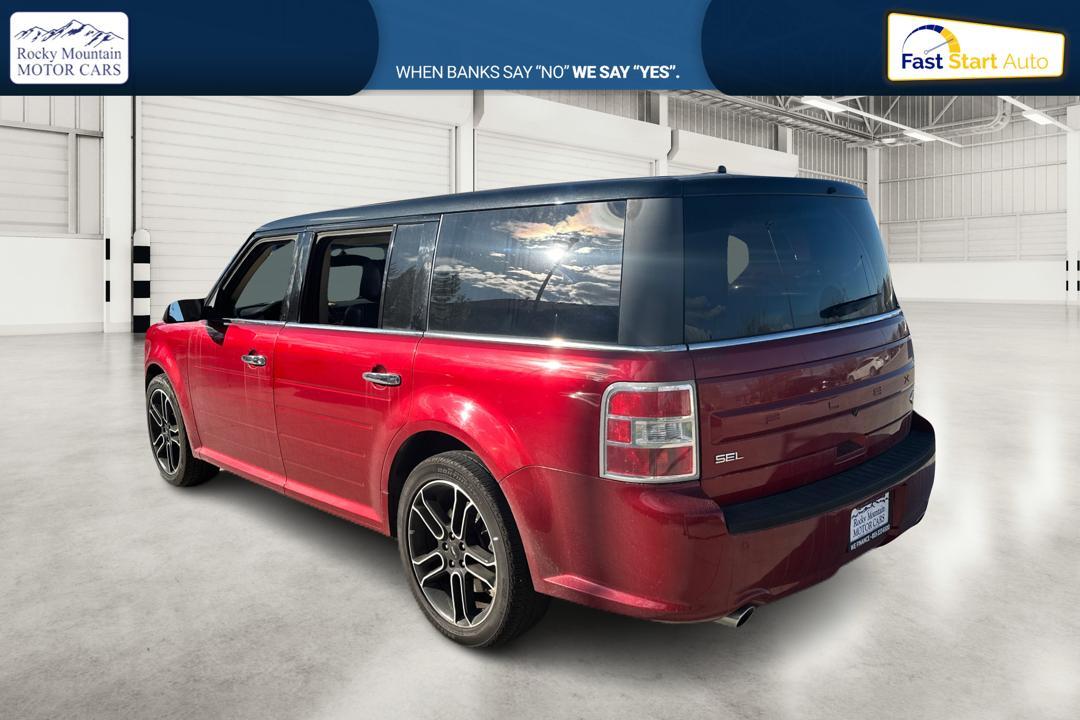 2015 Red Ford Flex SEL FWD (2FMGK5C85FB) with an 3.5L V6 DOHC 24V engine, 6-Speed Automatic Overdrive transmission, located at 344 S Washington Blvd, Ogden, UT, 84404, (801) 399-1799, 41.255482, -111.970848 - Photo #4