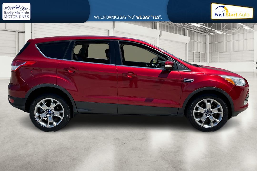 2013 Red Ford Escape SEL FWD (1FMCU0HX1DU) with an 1.6L L4 DOHC 16V engine, 6-Speed Automatic transmission, located at 767 S State Road, Pleasant Grove, UT, 84062, (801) 785-1058, 40.354839, -111.736687 - Photo #1