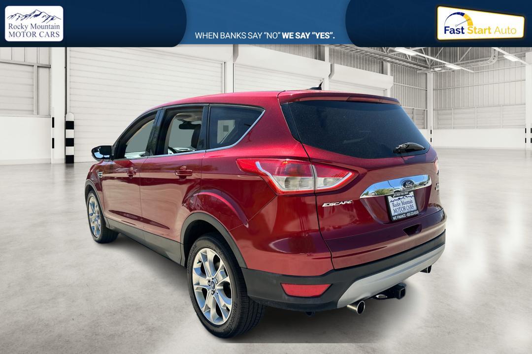 2013 Red Ford Escape SEL FWD (1FMCU0HX1DU) with an 1.6L L4 DOHC 16V engine, 6-Speed Automatic transmission, located at 767 S State Road, Pleasant Grove, UT, 84062, (801) 785-1058, 40.354839, -111.736687 - Photo #4