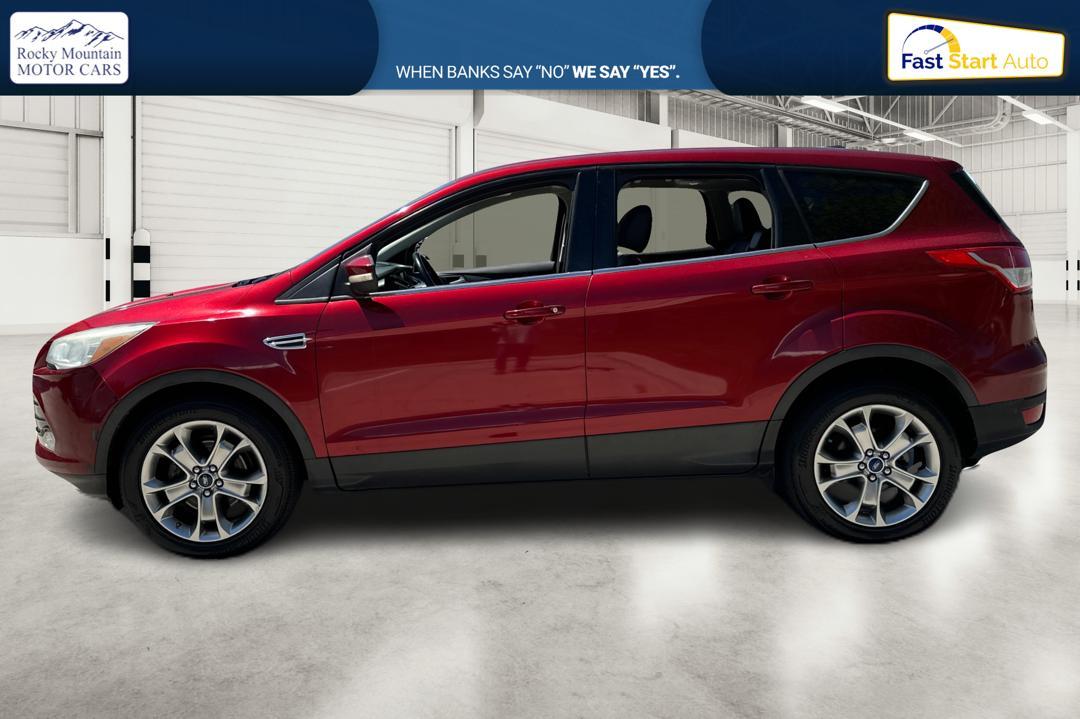 2013 Red Ford Escape SEL FWD (1FMCU0HX1DU) with an 1.6L L4 DOHC 16V engine, 6-Speed Automatic transmission, located at 767 S State Road, Pleasant Grove, UT, 84062, (801) 785-1058, 40.354839, -111.736687 - Photo #5
