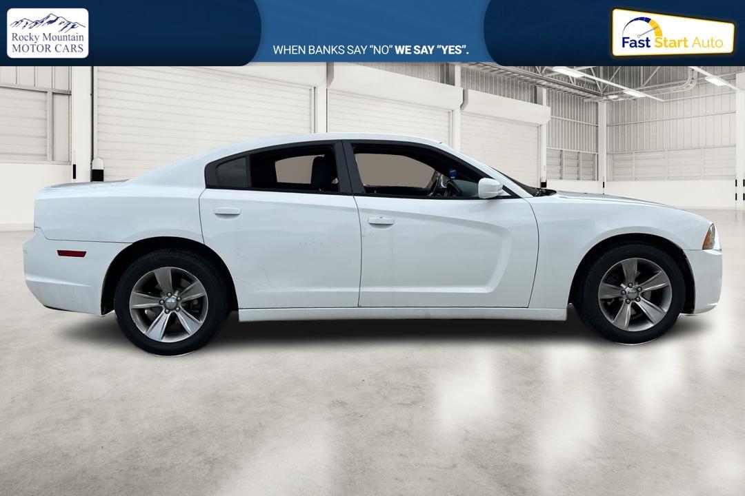 2014 White Dodge Charger SE (2C3CDXBG4EH) with an 3.6L V6 DOHC 24V engine, 5-Speed Automatic transmission, located at 767 S State Road, Pleasant Grove, UT, 84062, (801) 785-1058, 40.354839, -111.736687 - Photo#1