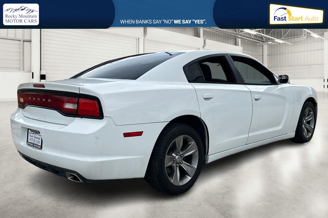 2014 White Dodge Charger SE (2C3CDXBG4EH) with an 3.6L V6 DOHC 24V engine, 5-Speed Automatic transmission, located at 767 S State Road, Pleasant Grove, UT, 84062, (801) 785-1058, 40.354839, -111.736687 - Photo#2