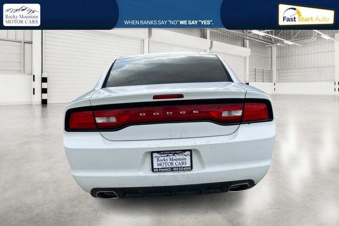 2014 White Dodge Charger SE (2C3CDXBG4EH) with an 3.6L V6 DOHC 24V engine, 5-Speed Automatic transmission, located at 767 S State Road, Pleasant Grove, UT, 84062, (801) 785-1058, 40.354839, -111.736687 - Photo#4