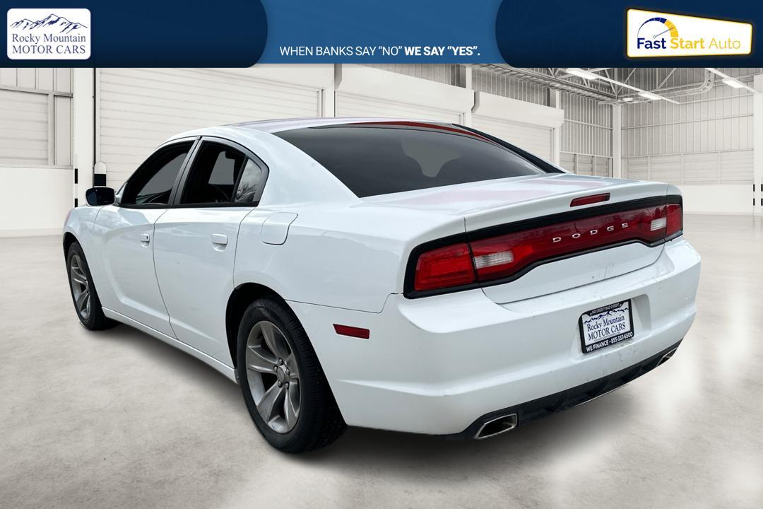 2014 White Dodge Charger SE (2C3CDXBG4EH) with an 3.6L V6 DOHC 24V engine, 5-Speed Automatic transmission, located at 767 S State Road, Pleasant Grove, UT, 84062, (801) 785-1058, 40.354839, -111.736687 - Photo#5