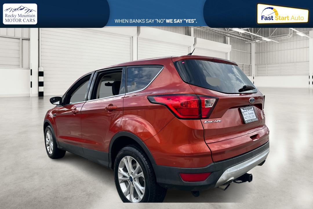 2019 Orange Ford Escape SE 4WD (1FMCU9GD0KU) with an 1.5L L4 DOHC 16V engine, 6A transmission, located at 767 S State Road, Pleasant Grove, UT, 84062, (801) 785-1058, 40.354839, -111.736687 - Photo #4