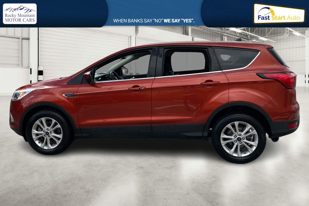 2019 Orange Ford Escape SE 4WD (1FMCU9GD0KU) with an 1.5L L4 DOHC 16V engine, 6A transmission, located at 767 S State Road, Pleasant Grove, UT, 84062, (801) 785-1058, 40.354839, -111.736687 - Photo #5