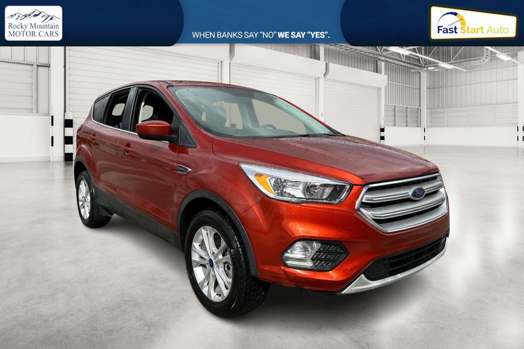 2019 Orange Ford Escape SE 4WD (1FMCU9GD0KU) with an 1.5L L4 DOHC 16V engine, 6A transmission, located at 767 S State Road, Pleasant Grove, UT, 84062, (801) 785-1058, 40.354839, -111.736687 - Photo #0