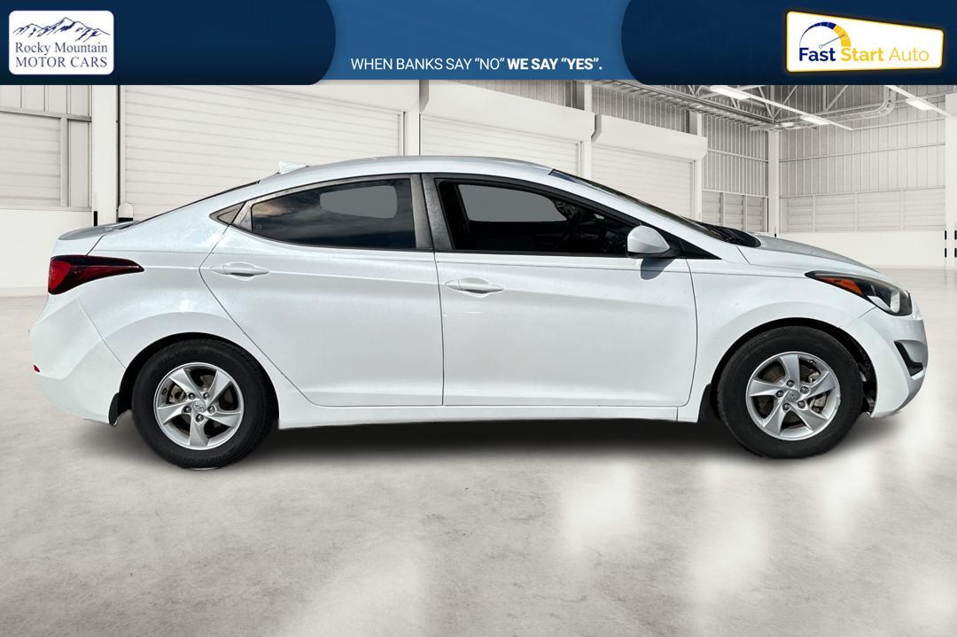 2015 White Hyundai Elantra Limited (5NPDH4AE9FH) with an 1.8L L4 DOHC 16V engine, 6-Speed Automatic transmission, located at 344 S Washington Blvd, Ogden, UT, 84404, (801) 399-1799, 41.255482, -111.970848 - Photo #1