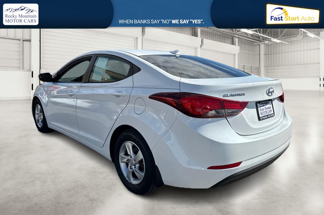 2015 White Hyundai Elantra Limited (5NPDH4AE9FH) with an 1.8L L4 DOHC 16V engine, 6-Speed Automatic transmission, located at 344 S Washington Blvd, Ogden, UT, 84404, (801) 399-1799, 41.255482, -111.970848 - Photo #4