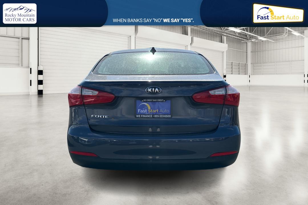 2016 Blue Kia Forte LX w/Popular Package (KNAFK4A66G5) with an 1.8L L4 DOHC 16V engine, Auto, 6-Spd w/Sportmatic and Active ECO System transmission, located at 7755 State Street, Midvale, UT, 84047, (801) 753-9063, 40.610329, -111.892159 - Photo #3