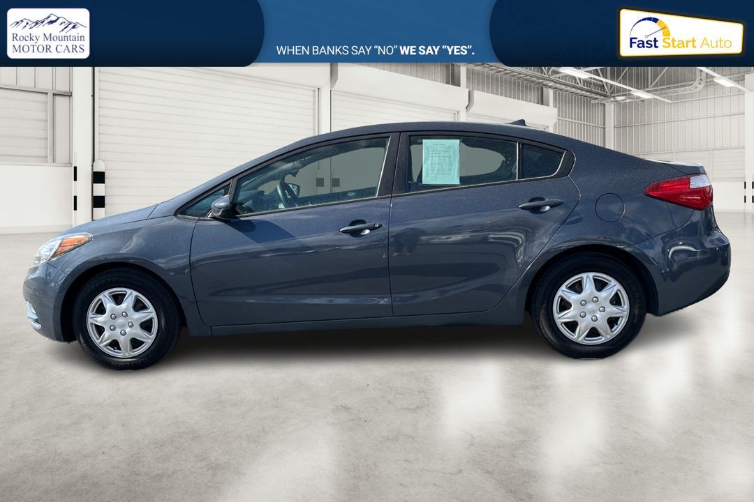 2016 Blue Kia Forte LX w/Popular Package (KNAFK4A66G5) with an 1.8L L4 DOHC 16V engine, Auto, 6-Spd w/Sportmatic and Active ECO System transmission, located at 7755 State Street, Midvale, UT, 84047, (801) 753-9063, 40.610329, -111.890656 - Photo #5