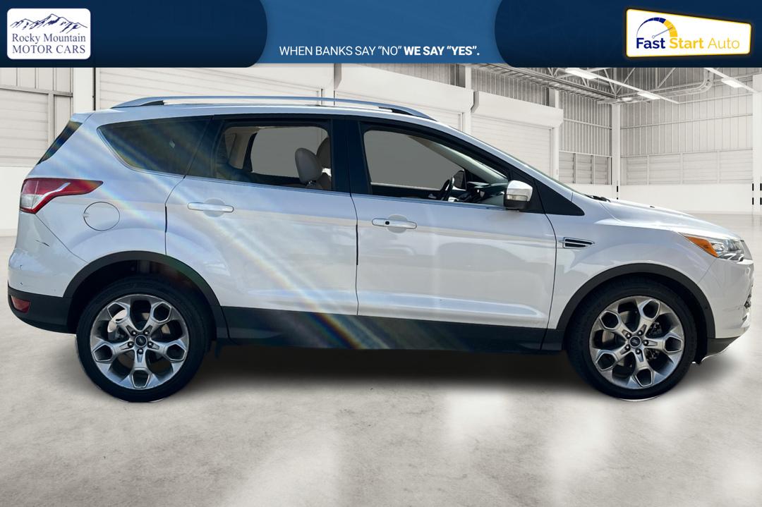 2014 White Ford Escape Titanium 4WD (1FMCU9J96EU) with an 2.0L L4 DOHC 16V engine, 6-Speed Automatic transmission, located at 7755 State Street, Midvale, UT, 84047, (801) 753-9063, 40.610329, -111.892159 - Photo#1