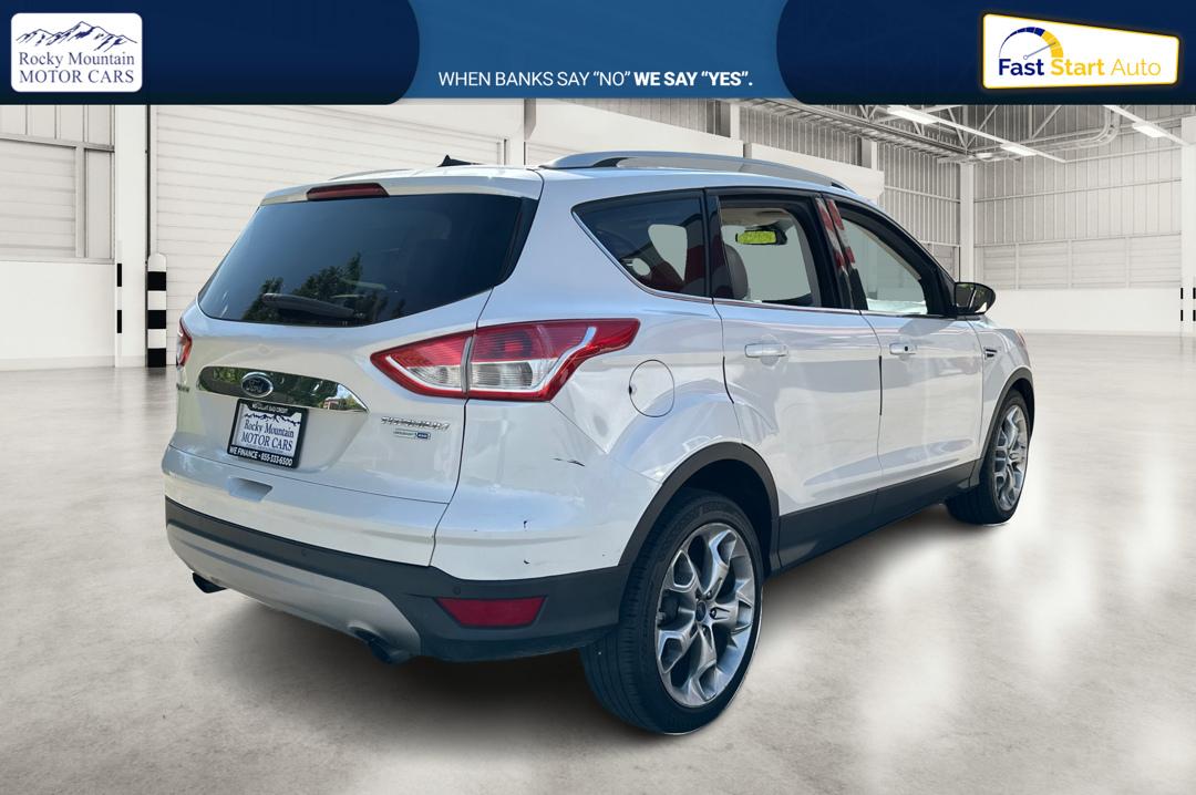 2014 White Ford Escape Titanium 4WD (1FMCU9J96EU) with an 2.0L L4 DOHC 16V engine, 6-Speed Automatic transmission, located at 7755 State Street, Midvale, UT, 84047, (801) 753-9063, 40.610329, -111.892159 - Photo#2
