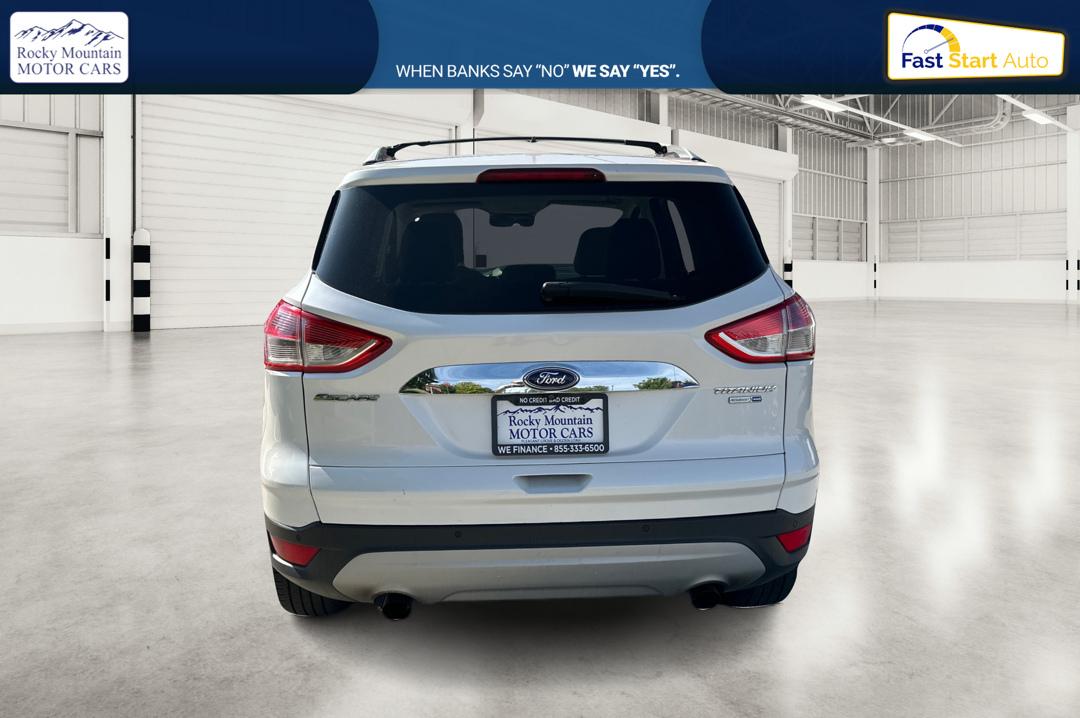 2014 White Ford Escape Titanium 4WD (1FMCU9J96EU) with an 2.0L L4 DOHC 16V engine, 6-Speed Automatic transmission, located at 7755 State Street, Midvale, UT, 84047, (801) 753-9063, 40.610329, -111.892159 - Photo#4