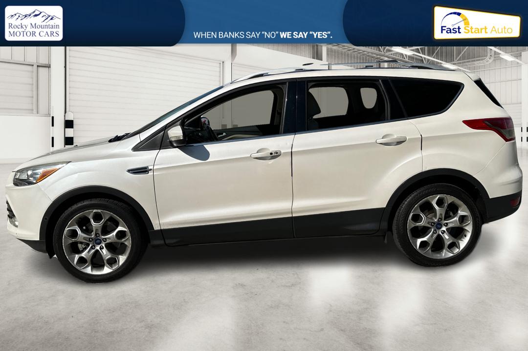 2014 White Ford Escape Titanium 4WD (1FMCU9J96EU) with an 2.0L L4 DOHC 16V engine, 6-Speed Automatic transmission, located at 7755 State Street, Midvale, UT, 84047, (801) 753-9063, 40.610329, -111.892159 - Photo#6