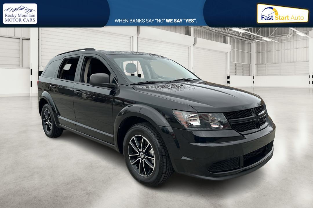 2018 Black Dodge Journey SE (3C4PDCAB6JT) with an 2.4L L4 DOHC 16V engine, 4A transmission, located at 767 S State Road, Pleasant Grove, UT, 84062, (801) 785-1058, 40.354839, -111.736687 - Photo #0