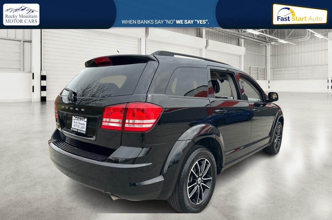 2018 Black Dodge Journey SE (3C4PDCAB6JT) with an 2.4L L4 DOHC 16V engine, 4A transmission, located at 767 S State Road, Pleasant Grove, UT, 84062, (801) 785-1058, 40.354839, -111.736687 - Photo #2