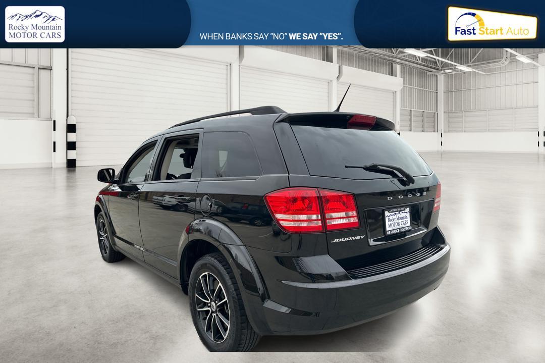 2018 Black Dodge Journey SE (3C4PDCAB6JT) with an 2.4L L4 DOHC 16V engine, 4A transmission, located at 767 S State Road, Pleasant Grove, UT, 84062, (801) 785-1058, 40.354839, -111.736687 - Photo #4