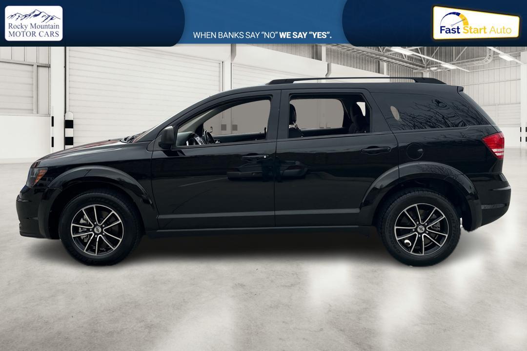 2018 Black Dodge Journey SE (3C4PDCAB6JT) with an 2.4L L4 DOHC 16V engine, 4A transmission, located at 767 S State Road, Pleasant Grove, UT, 84062, (801) 785-1058, 40.354839, -111.736687 - Photo #5